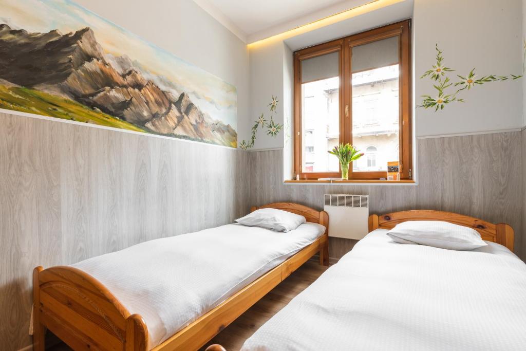 Posteľ alebo postele v izbe v ubytovaní Top Hostel Pokoje Gościnne