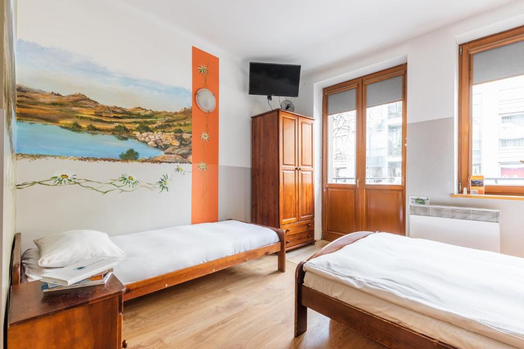 Posteľ alebo postele v izbe v ubytovaní Top Hostel Pokoje Gościnne