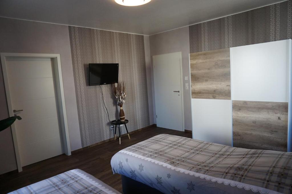 Postel nebo postele na pokoji v ubytování Super Erdgeschosswohnung