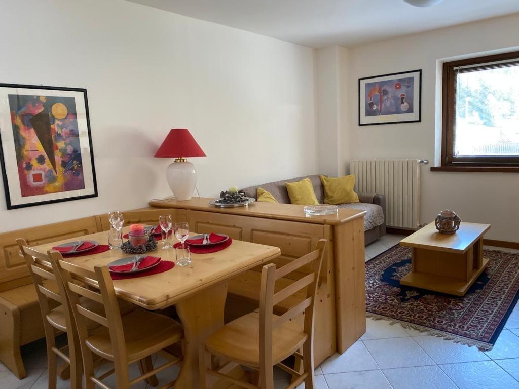 a living room with a table and a couch at Casa Bracchi in Valdisotto