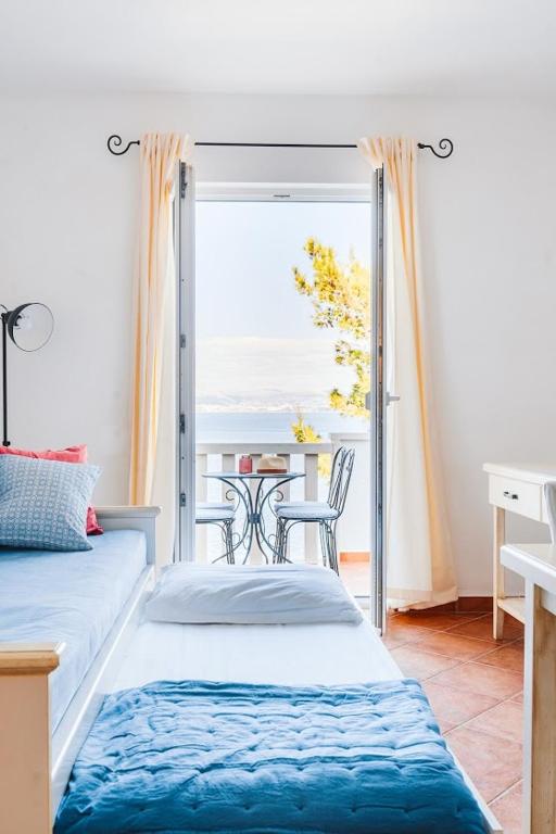 Postel nebo postele na pokoji v ubytování Sutivan Best Apartments