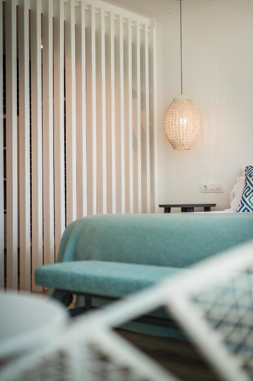 Postel nebo postele na pokoji v ubytování Blaumar Hotel