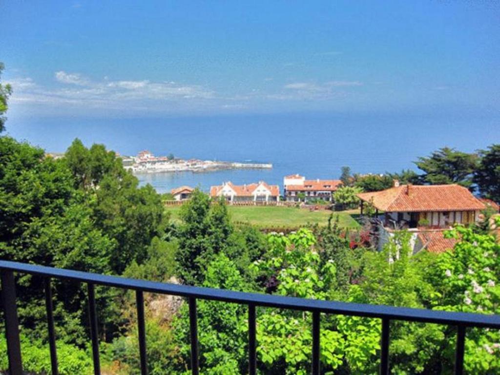 a view of the ocean from a balcony at Hotel Arha Mar Comillas in Comillas