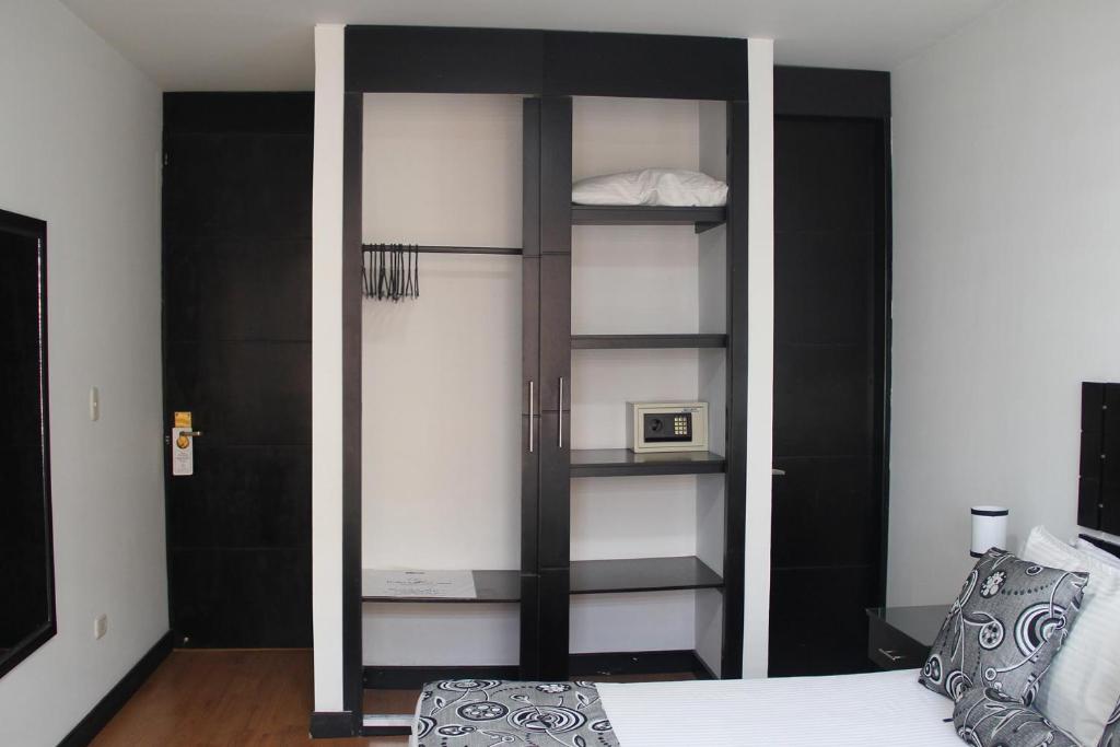 Postel nebo postele na pokoji v ubytování Hotel Santafe Real