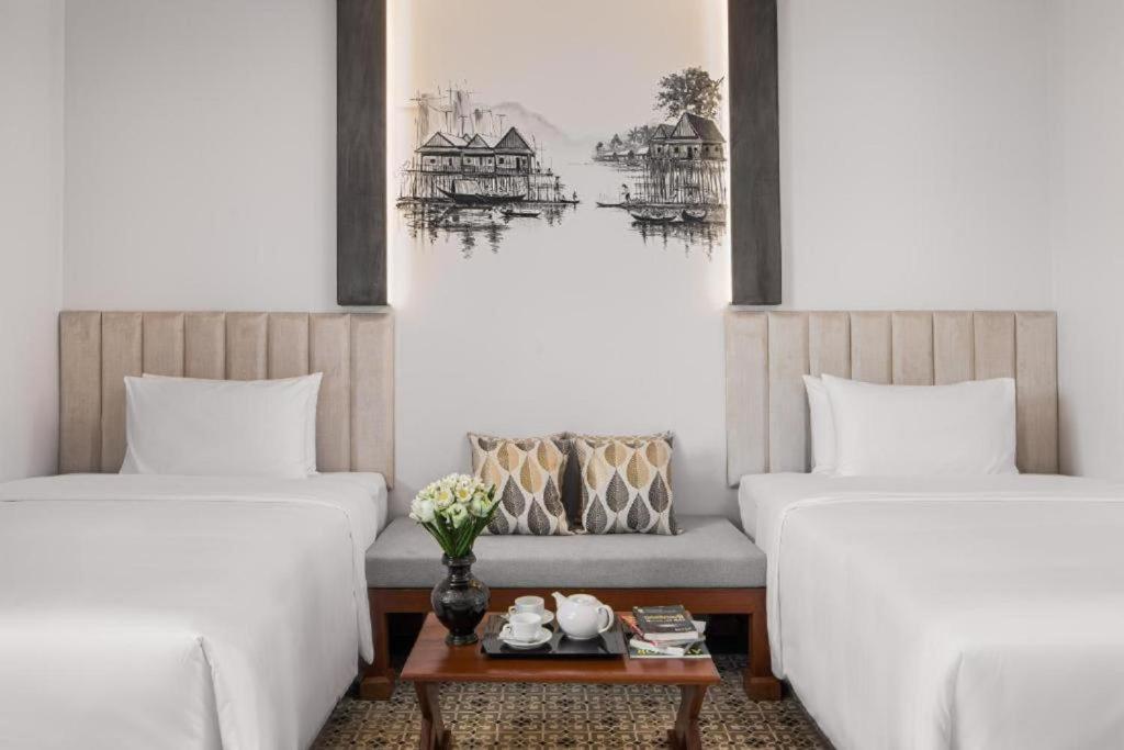 Postel nebo postele na pokoji v ubytování Siem Reap Palace Hotel & Spa