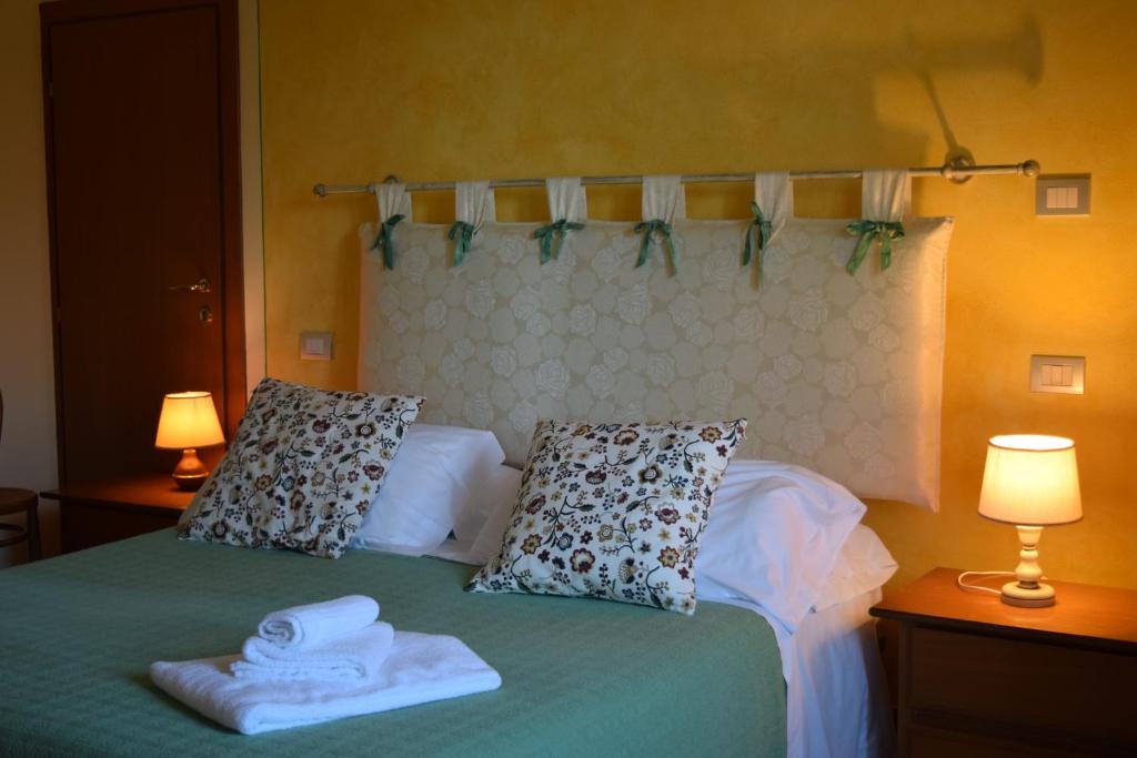 Posteľ alebo postele v izbe v ubytovaní Albergo Trattoria Fioravante