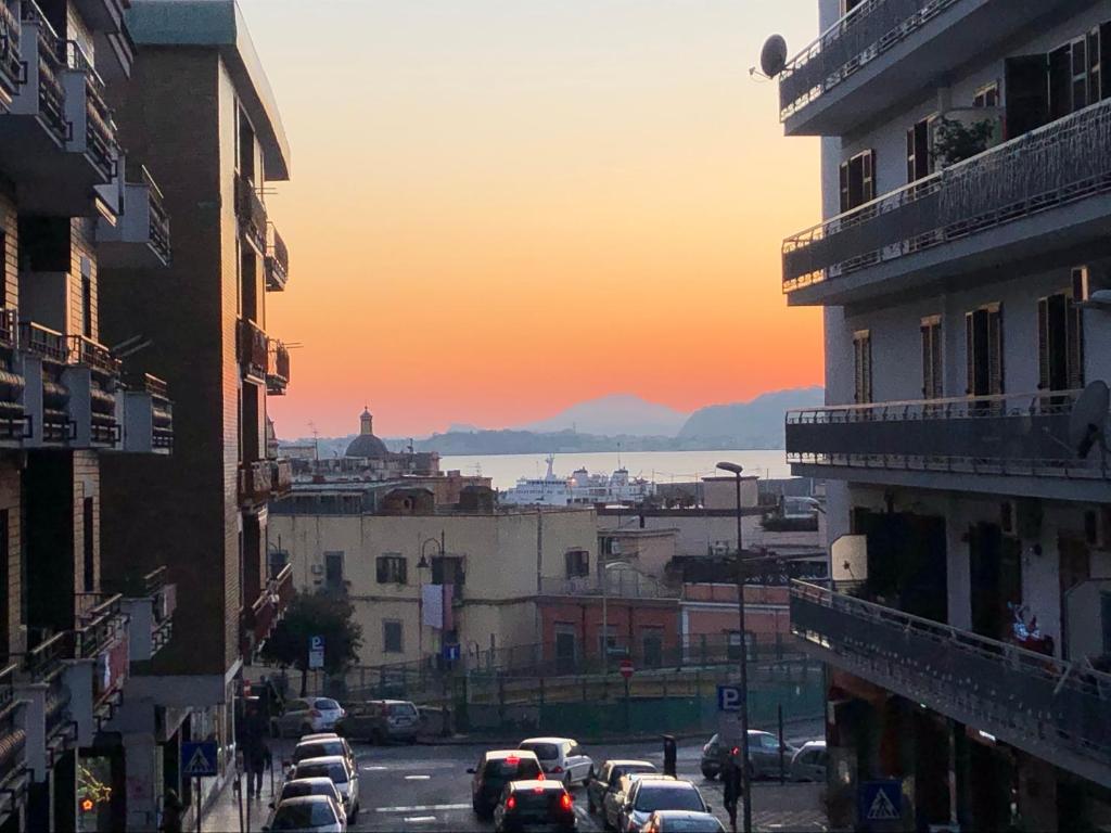 a view of a city with cars parked on a street at Lovely Home Marta in Pozzuoli