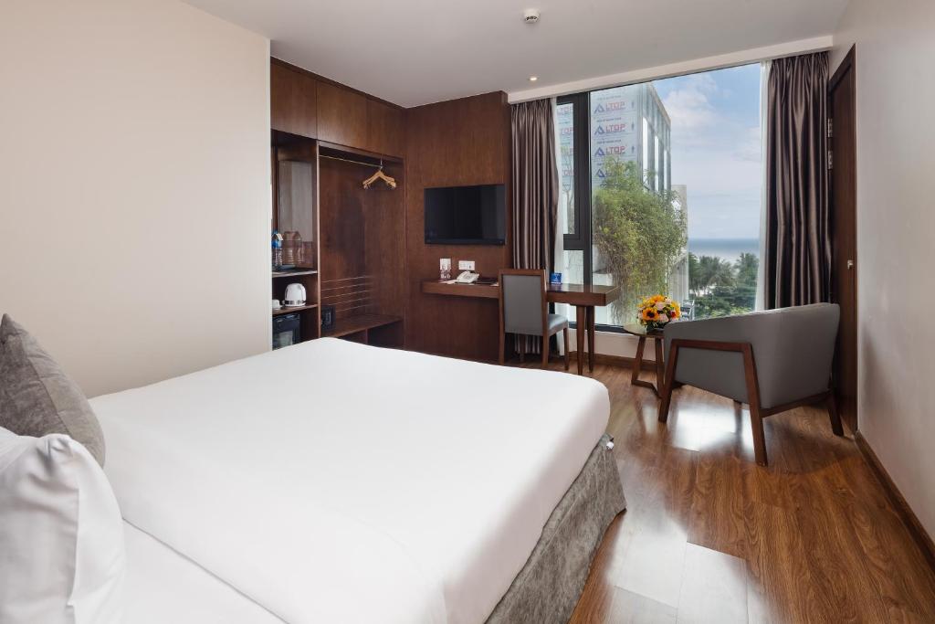 Giường trong phòng chung tại DTX Hotel Nha Trang