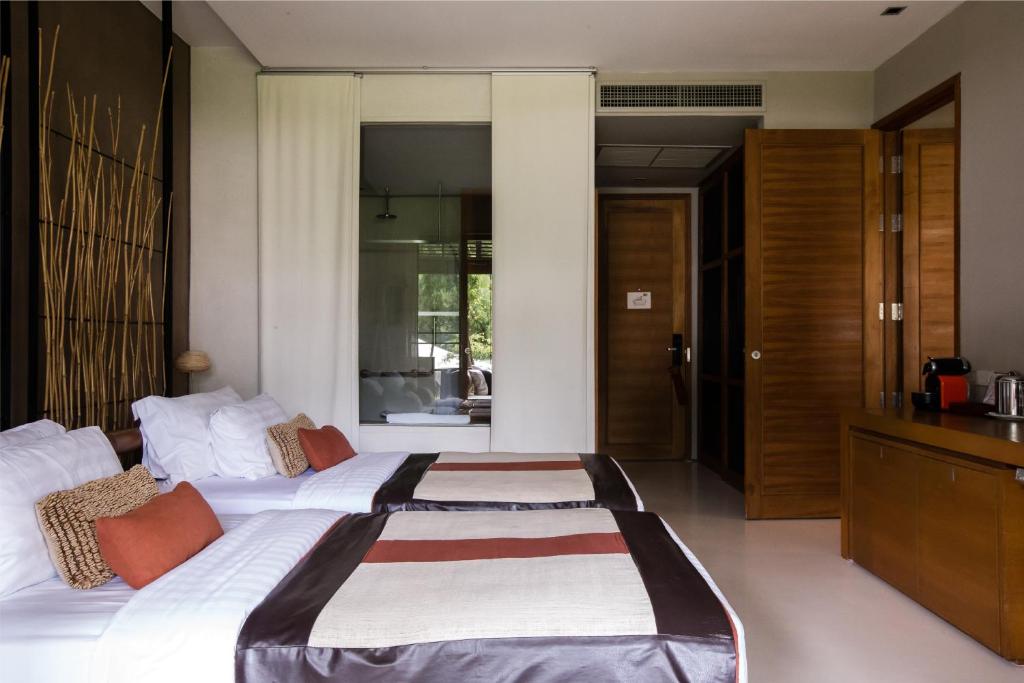 Una cama o camas en una habitación de Kirimaya Golf Resort Spa - SHA Plus Certified