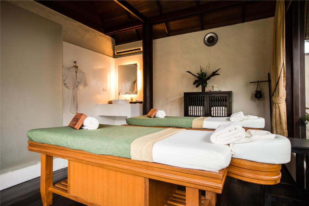 Una cama o camas en una habitación de Kirimaya Golf Resort Spa - SHA Plus Certified