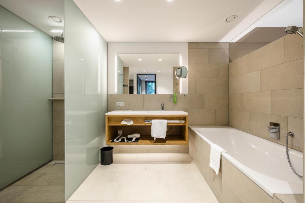 Koupelna v ubytování Montfort - das Hotel