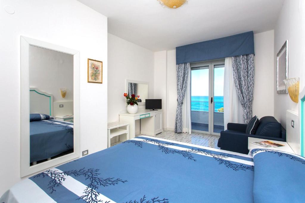 Postel nebo postele na pokoji v ubytování Hotel Ferretti