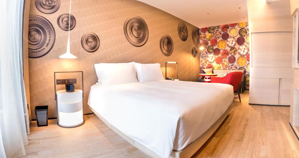 Postel nebo postele na pokoji v ubytování Hotel Indigo Kaohsiung Central Park by IHG