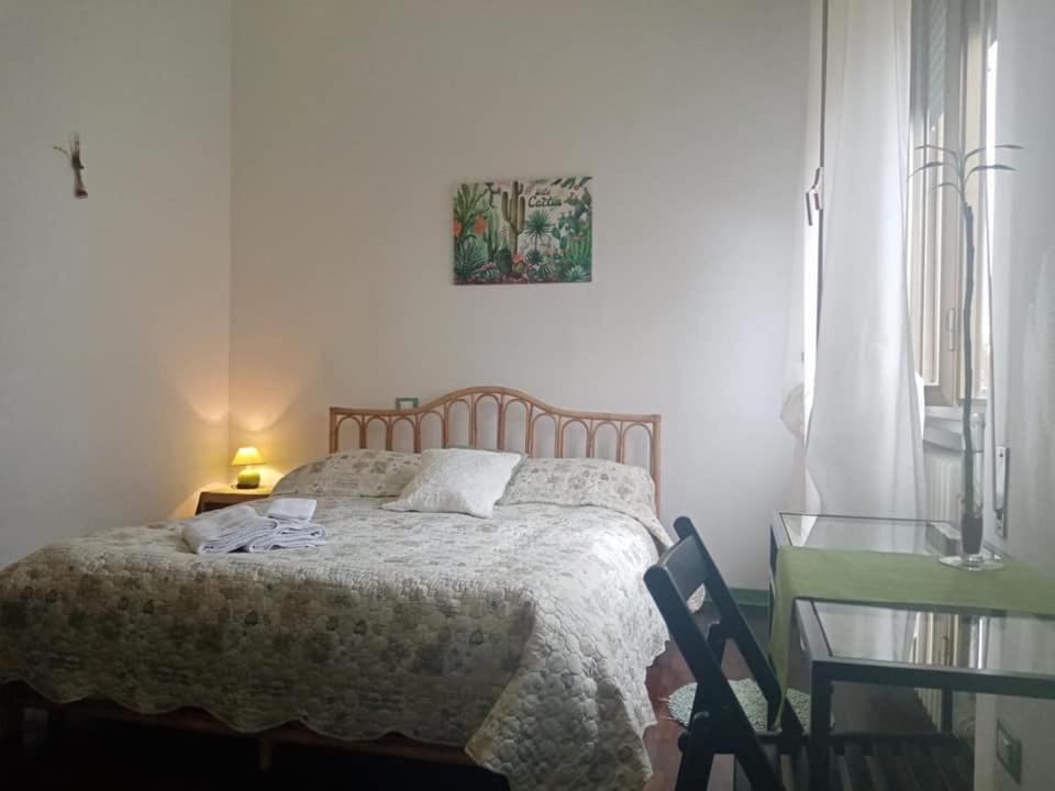 Łóżko lub łóżka w pokoju w obiekcie Florinda B&B Viareggio