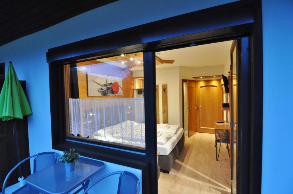 Letto o letti in una camera di Pension & Apartments Weissbriach