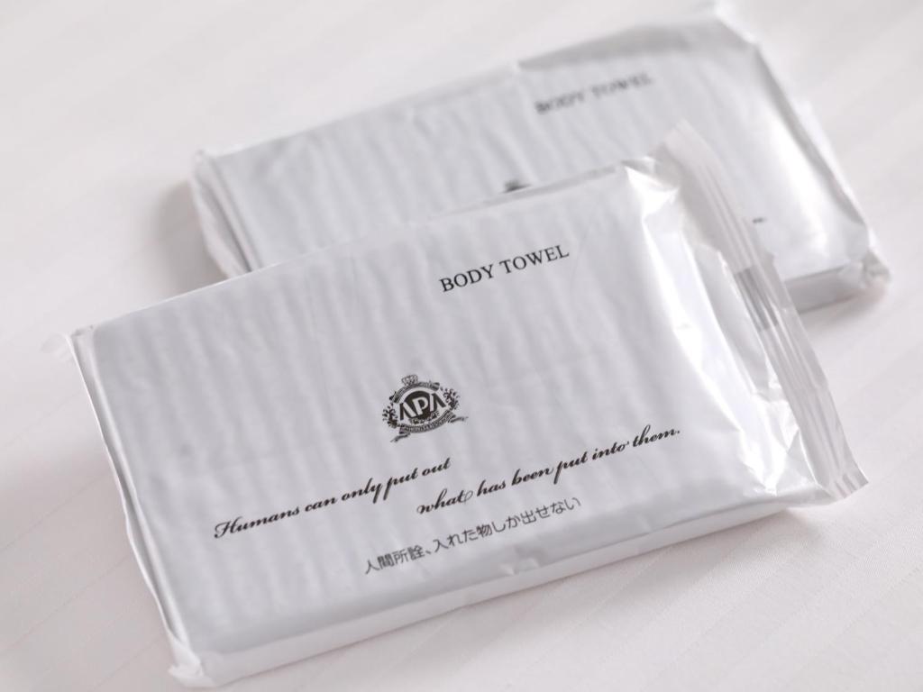 a couple of white envelopes sitting on a table at APA Hotel Ningyocho Ekikita in Tokyo
