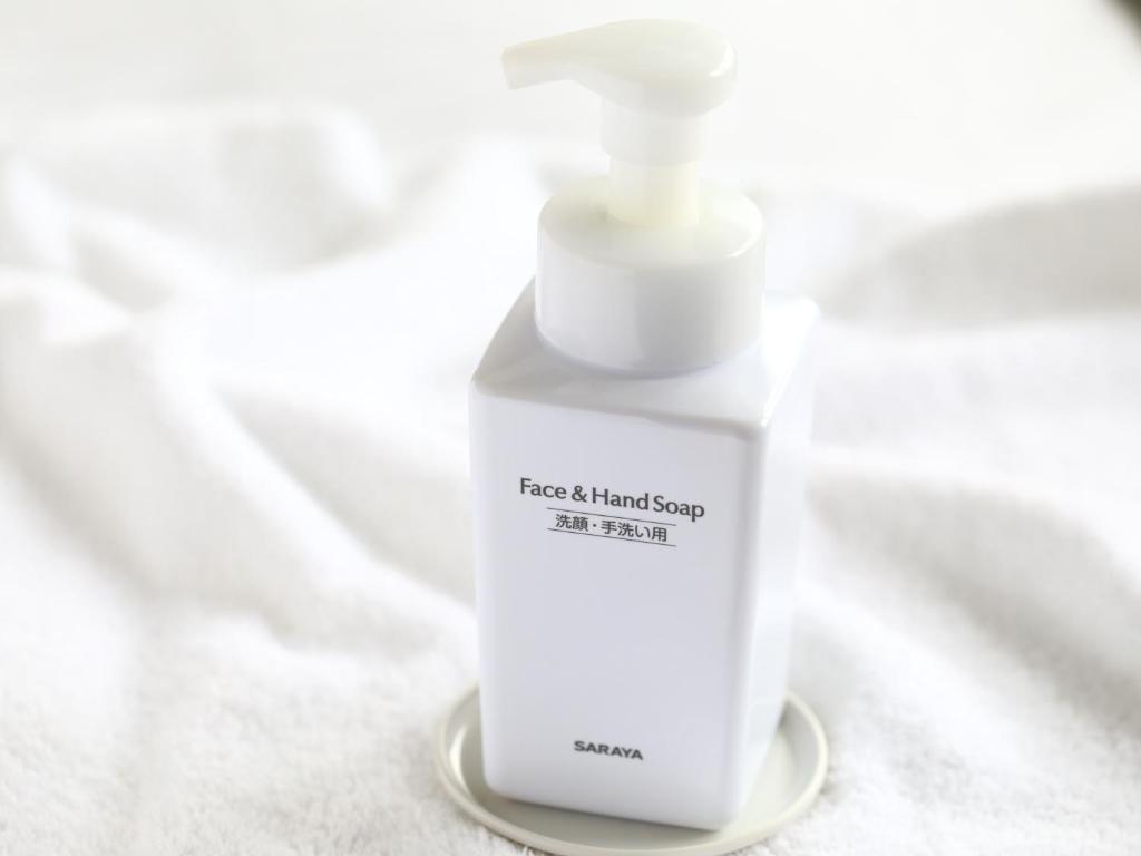a white bottle of hand soap sitting on a table at APA Hotel Ningyocho Ekikita in Tokyo