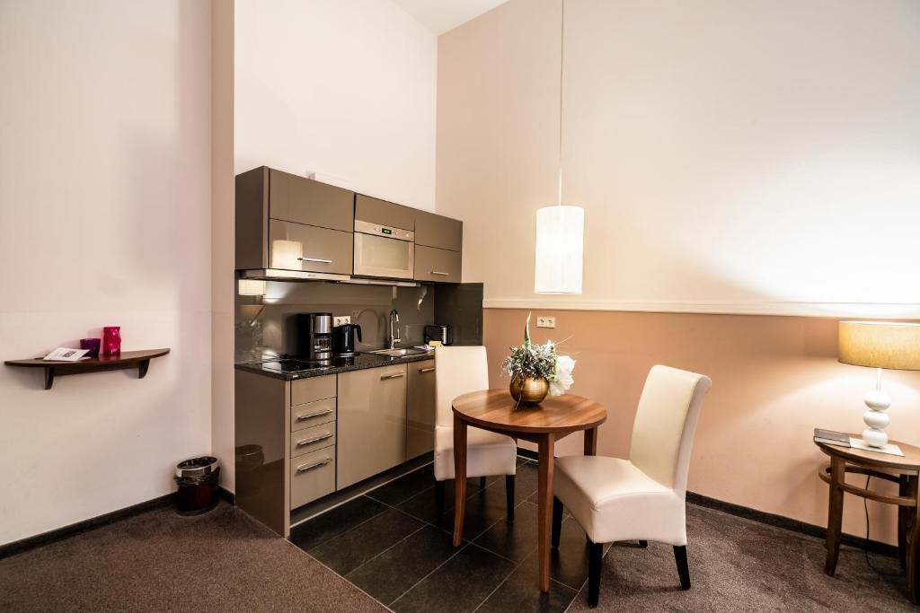 Kuchyň nebo kuchyňský kout v ubytování Aparthotel Am Schloss