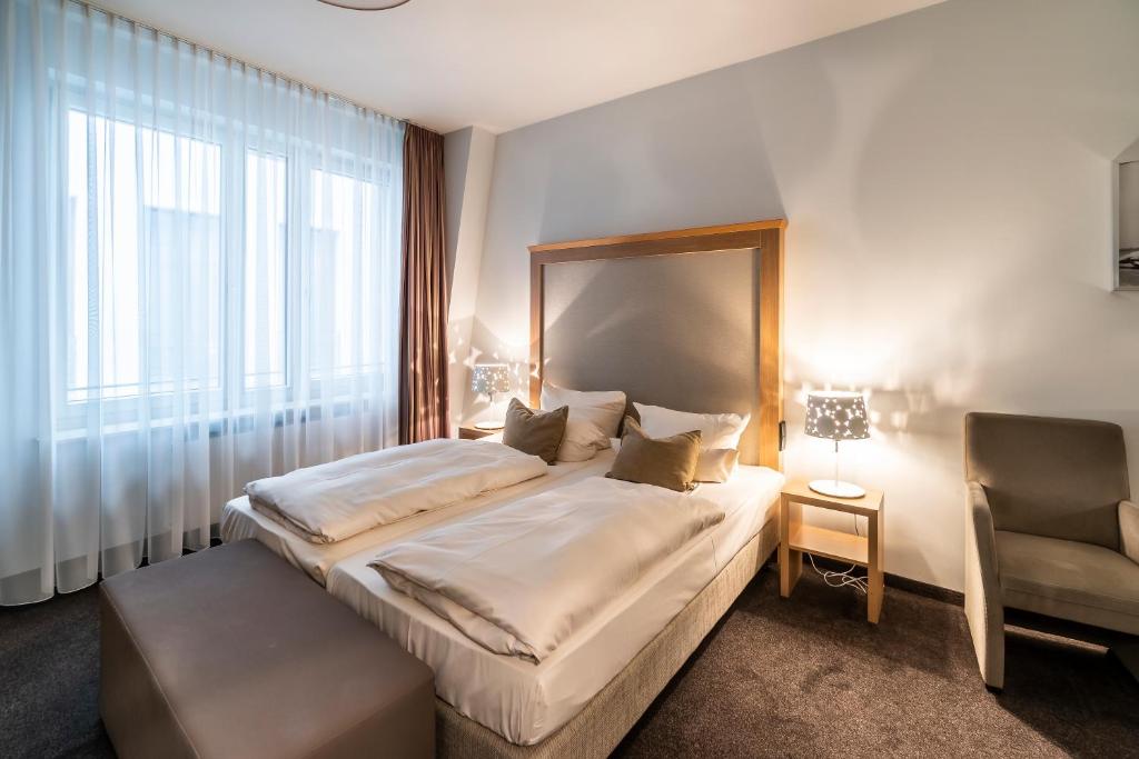 Postel nebo postele na pokoji v ubytování Aparthotel Am Schloss