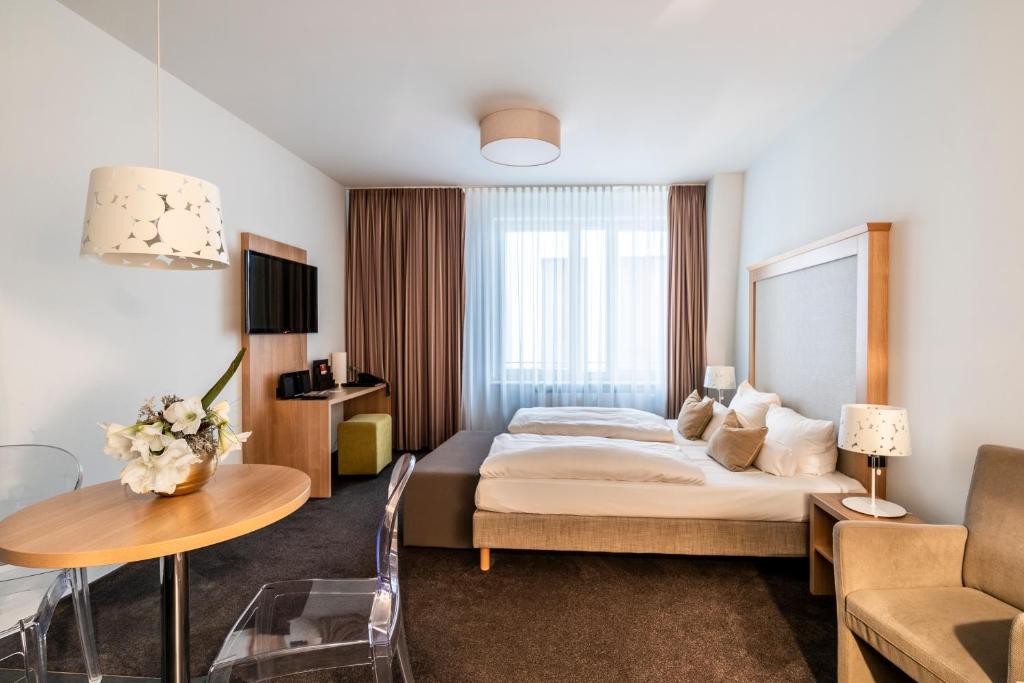 Postel nebo postele na pokoji v ubytování Aparthotel Am Schloss