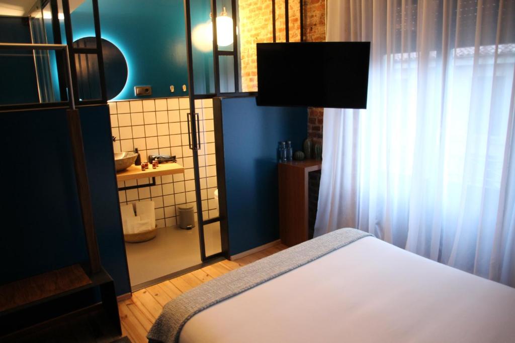 TV a/nebo společenská místnost v ubytování 13 suites