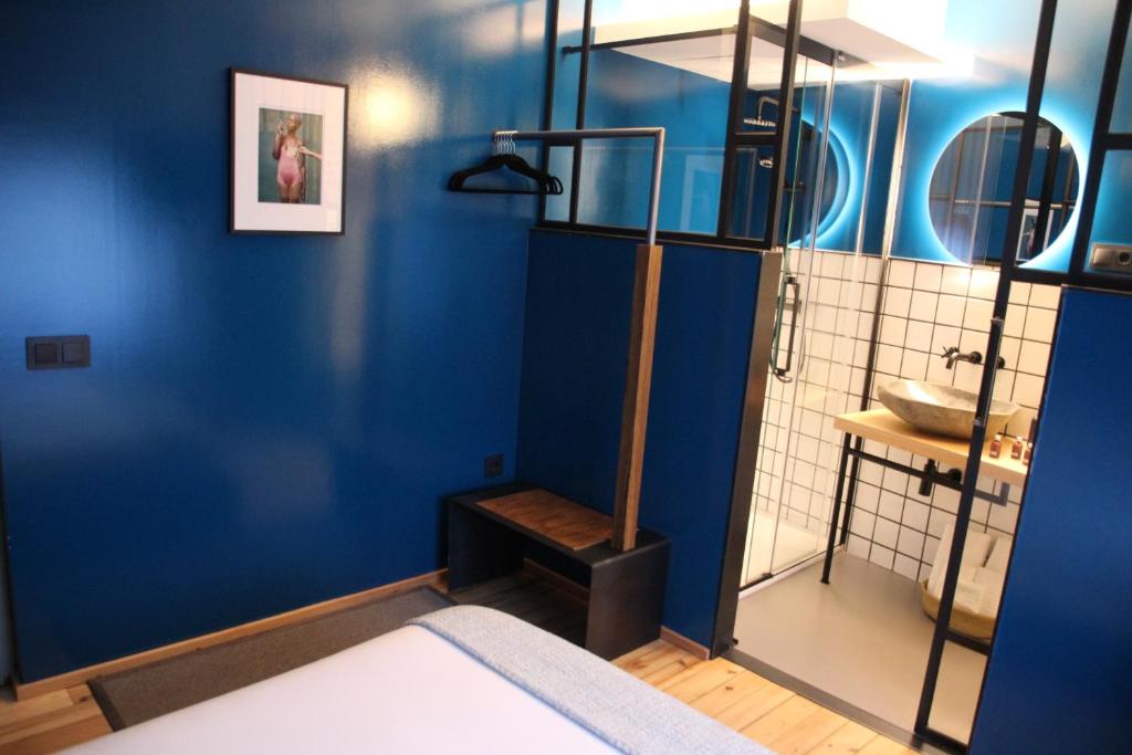 Postel nebo postele na pokoji v ubytování 13 suites