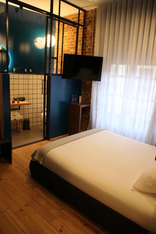Postel nebo postele na pokoji v ubytování 13 suites