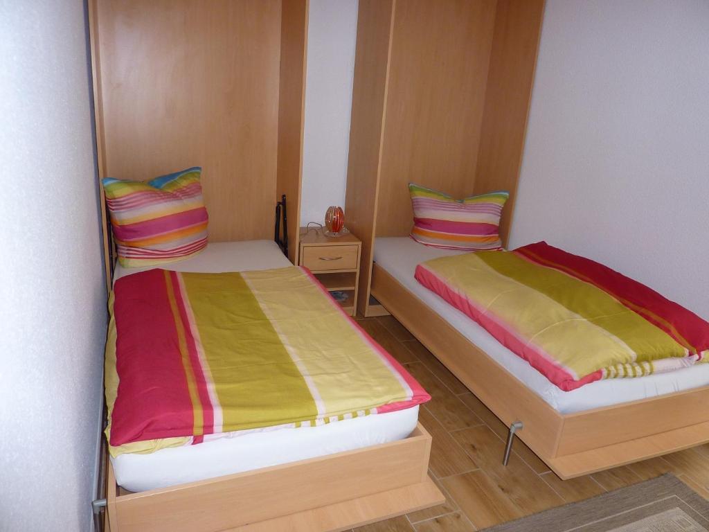 Postel nebo postele na pokoji v ubytování Pension zum Reiterhof