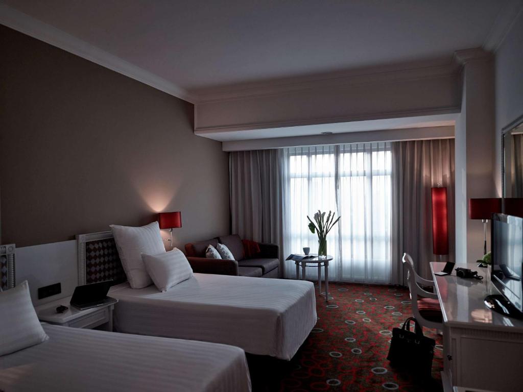 Postel nebo postele na pokoji v ubytování Pullman Hanoi