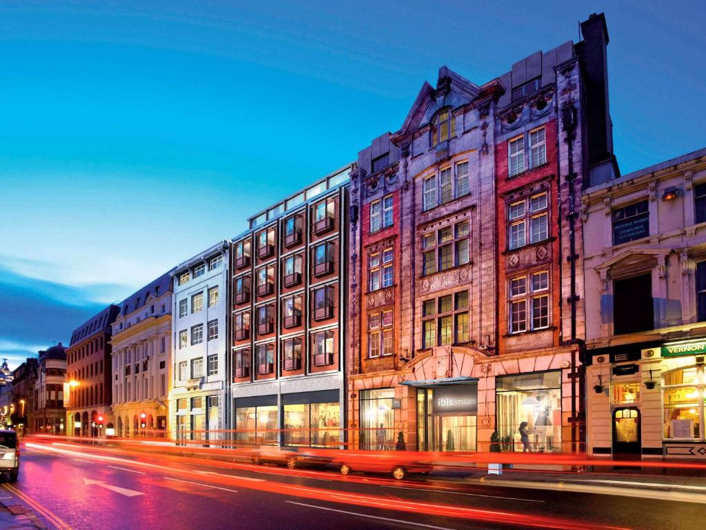 a row of buildings on a city street at night at Ibis Styles Liverpool Centre Dale Street - Cavern Quarter in Liverpool