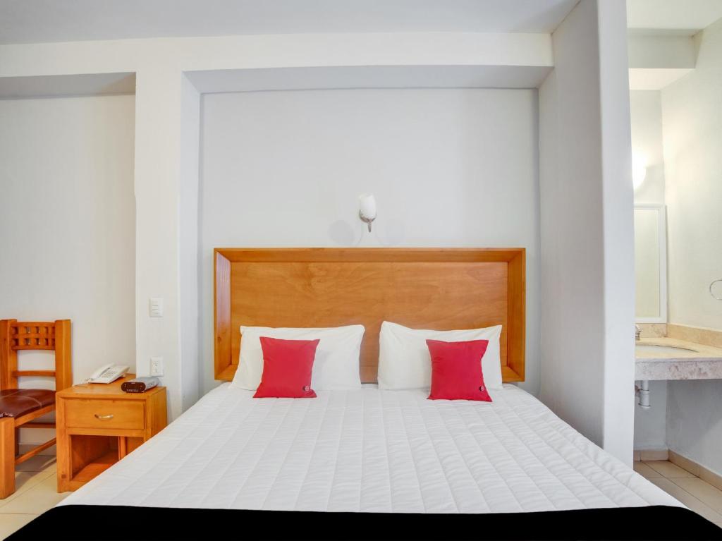 Postel nebo postele na pokoji v ubytování Hotel Patzcuaro