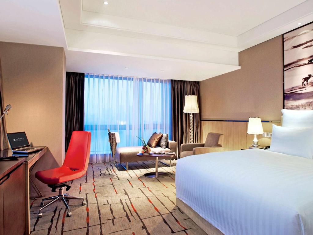 Postel nebo postele na pokoji v ubytování Pullman Xiamen Powerlong