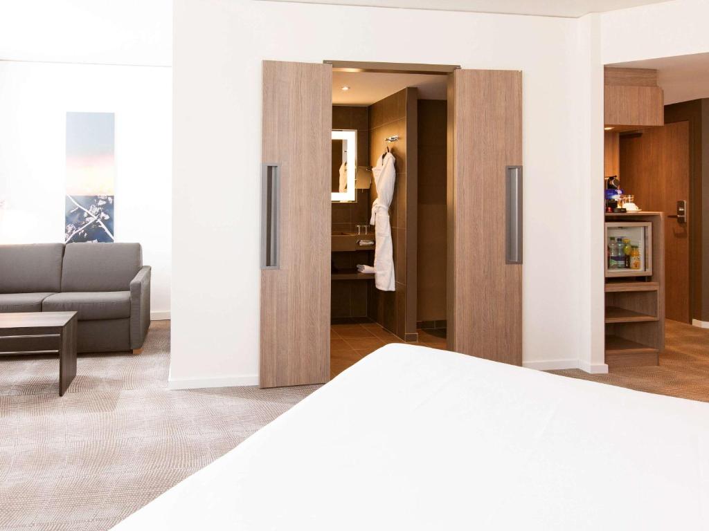 Postel nebo postele na pokoji v ubytování Novotel Basel City