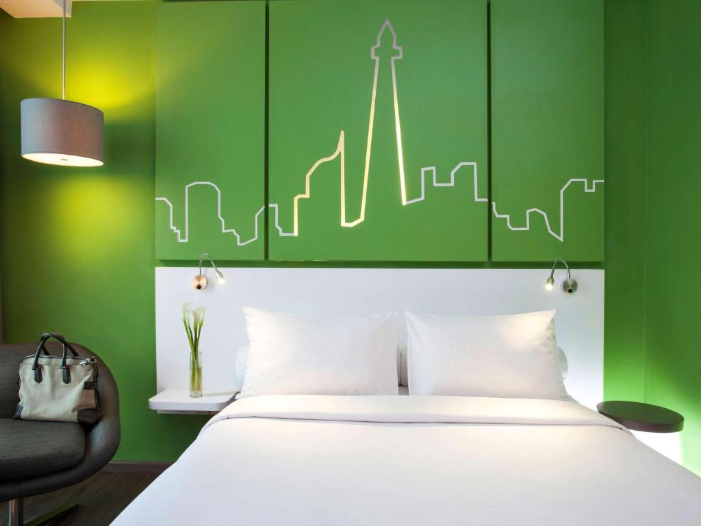 Letto o letti in una camera di All Seasons Jakarta Thamrin