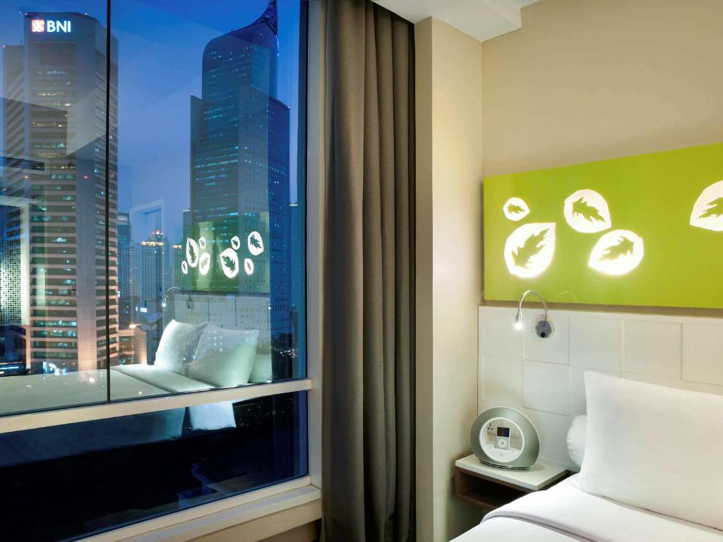 Letto o letti in una camera di All Seasons Jakarta Thamrin