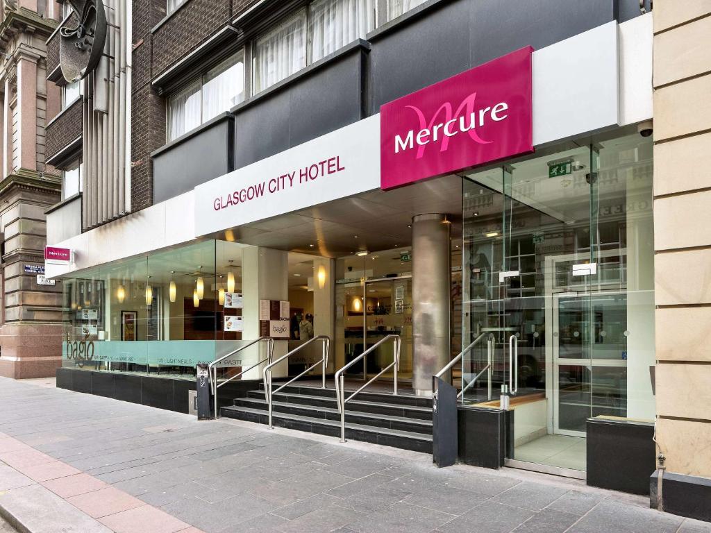 a store front of a building with a sign on it at Mercure Glasgow City Hotel in Glasgow