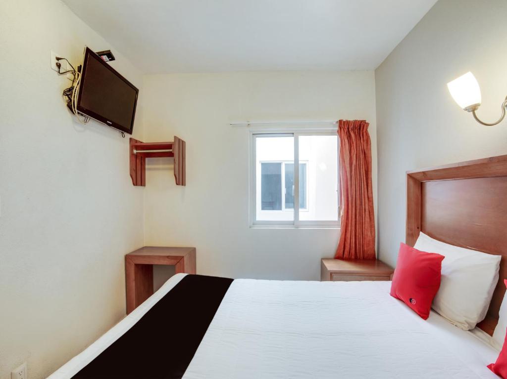 Postel nebo postele na pokoji v ubytování Hotel Patzcuaro
