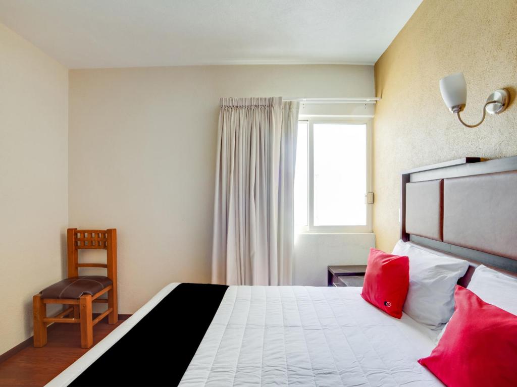 Postel nebo postele na pokoji v ubytování Hotel Patzcuaro