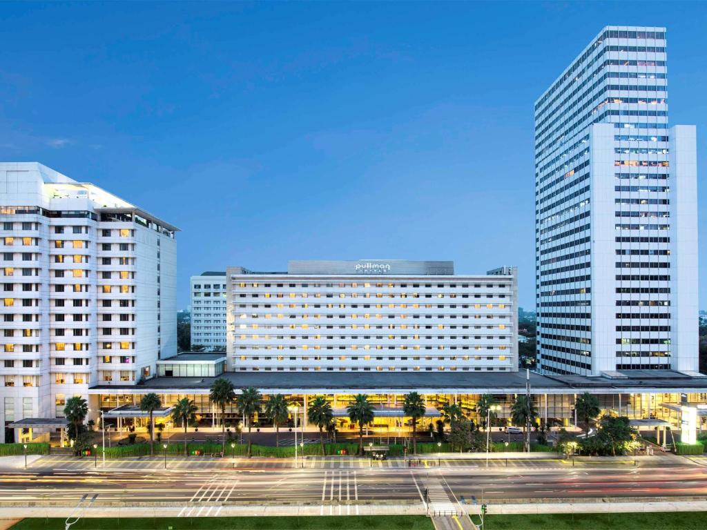 a view of a hotel with two tall buildings at Pullman Jakarta Indonesia in Jakarta