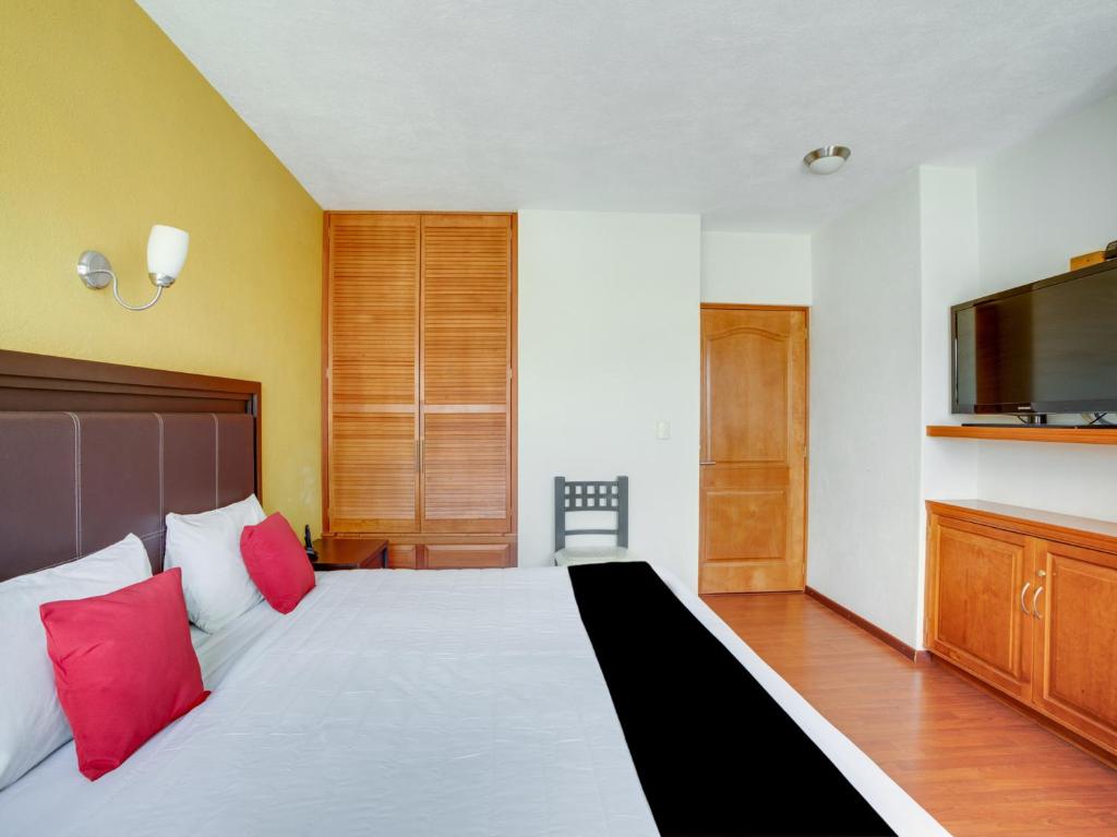 Postel nebo postele na pokoji v ubytování Hotel Patzcuaro