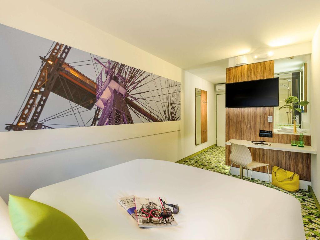 Telewizja i/lub zestaw kina domowego w obiekcie Ibis Styles Wien City