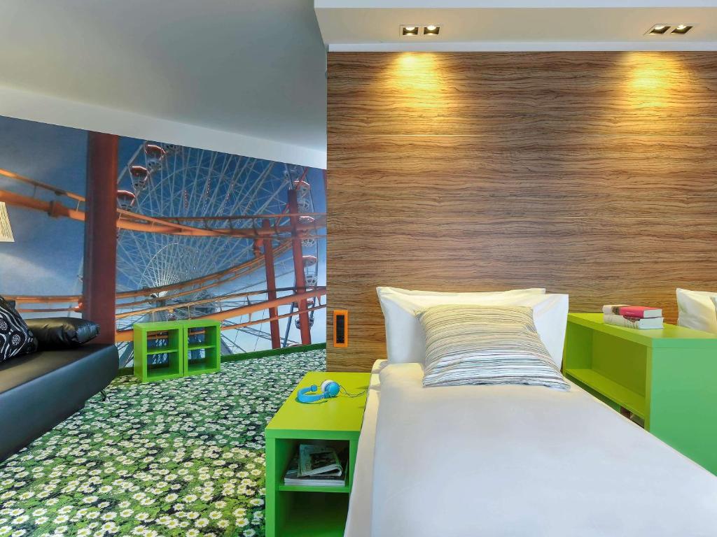 Łóżko lub łóżka w pokoju w obiekcie Ibis Styles Wien City