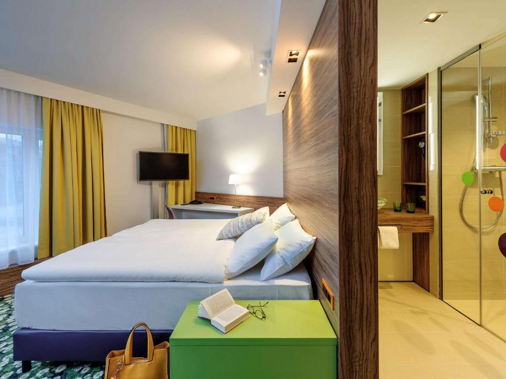 Łóżko lub łóżka w pokoju w obiekcie Ibis Styles Wien City