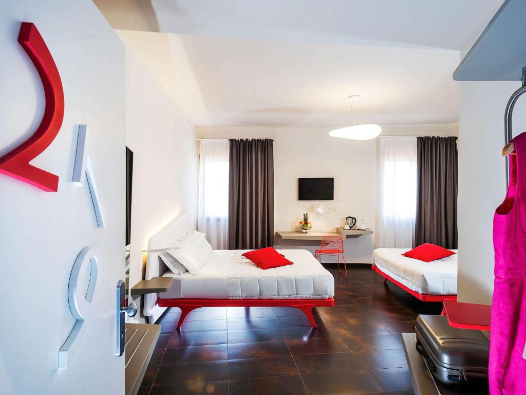 Postel nebo postele na pokoji v ubytování Ibis Styles Palermo President
