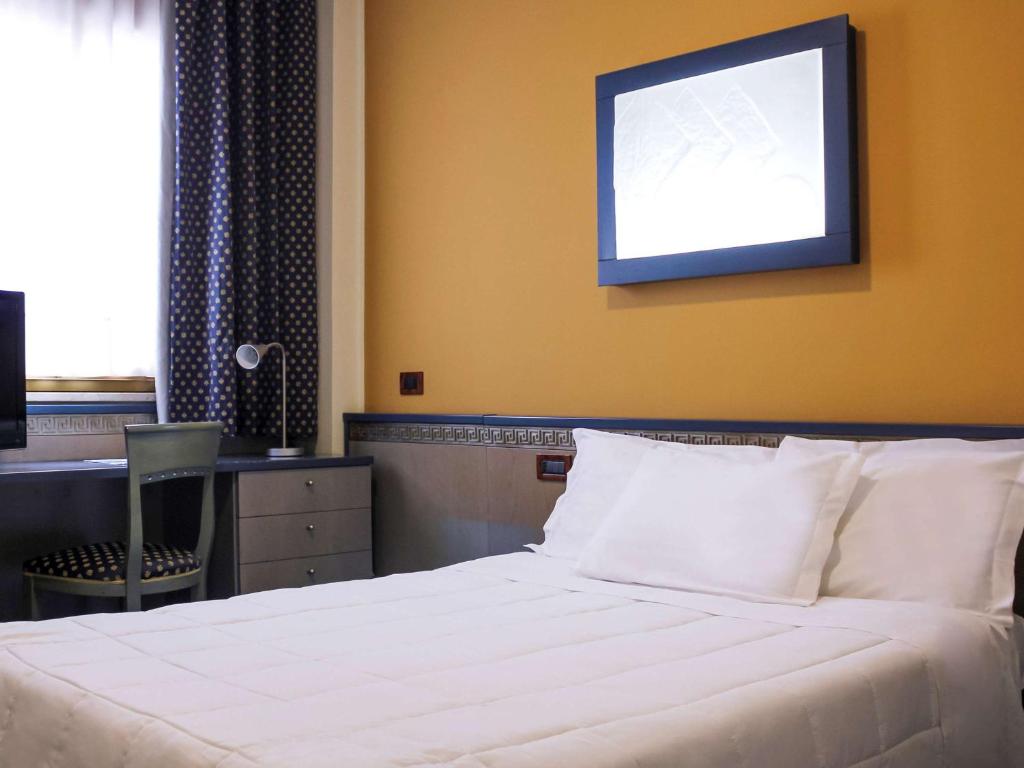 Postel nebo postele na pokoji v ubytování Ibis Styles Palermo President