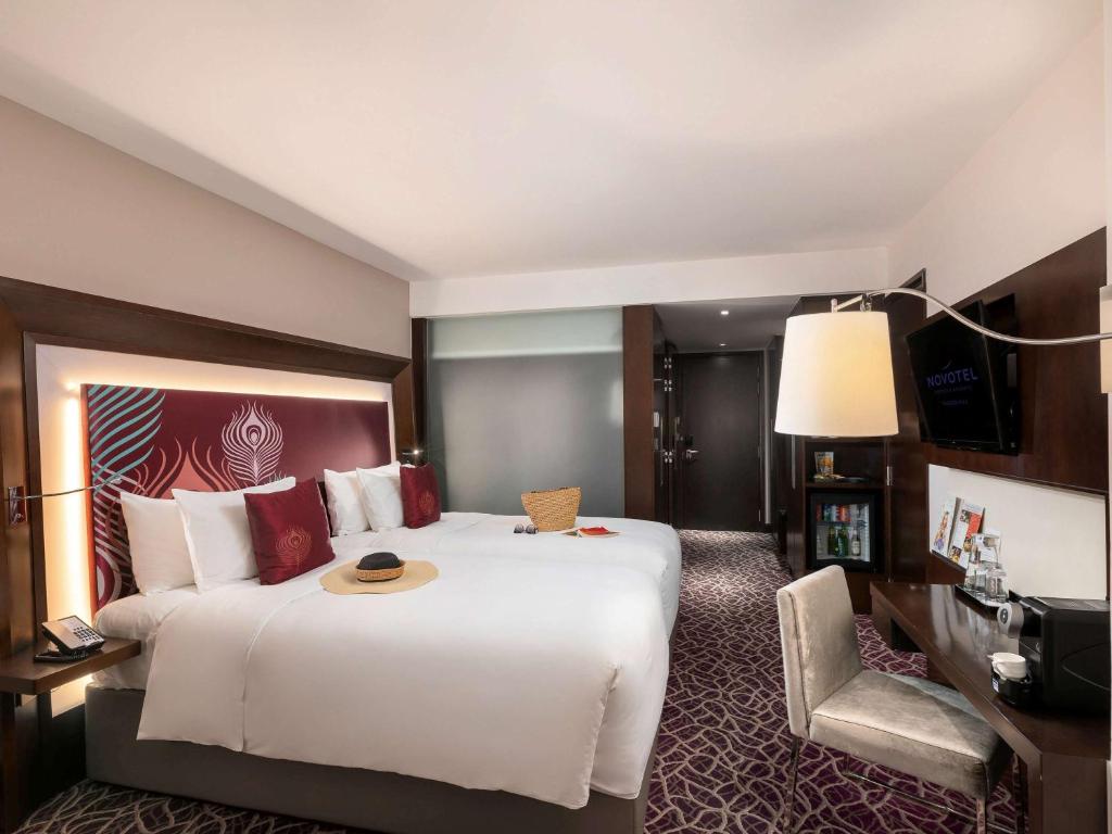 Voodi või voodid majutusasutuse Novotel Yangon Max toas