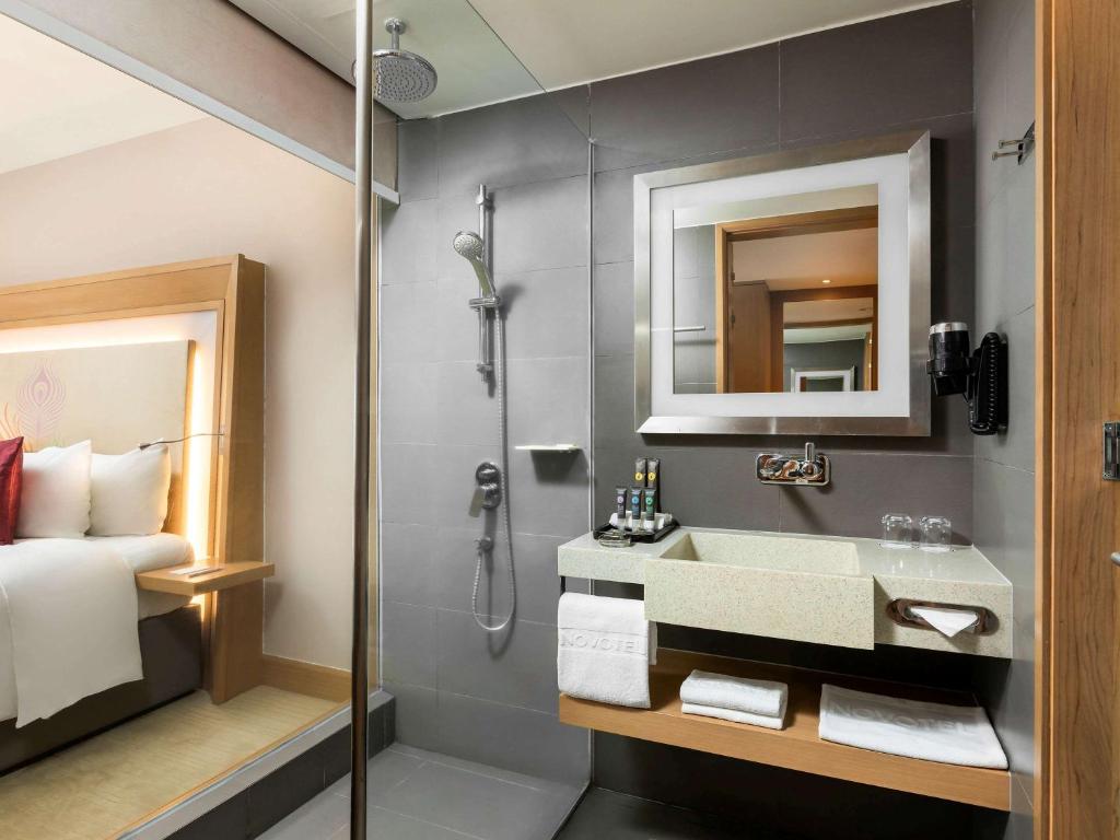 Voodi või voodid majutusasutuse Novotel Yangon Max toas