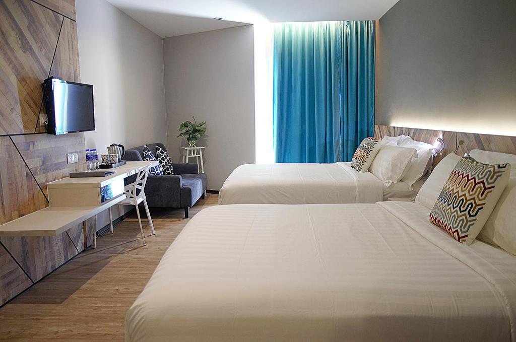 Tempat tidur dalam kamar di G5 HOTEL AND SERVICED APARTMENT