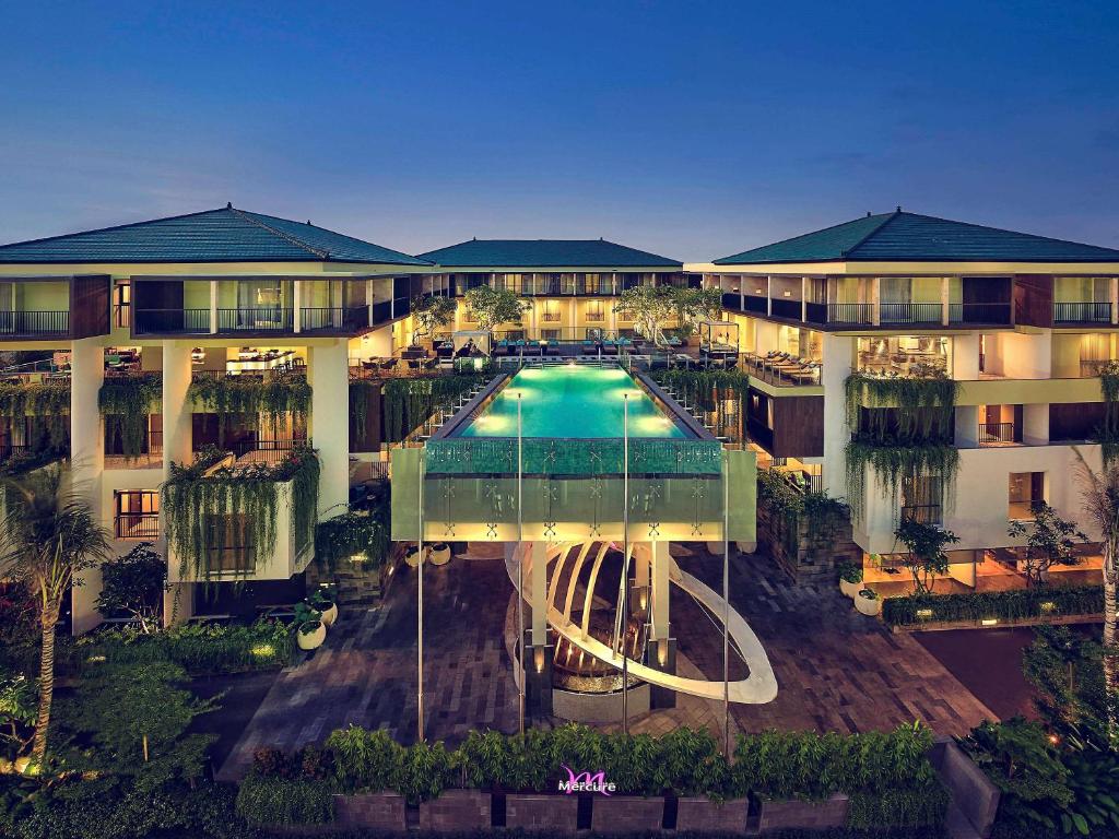 an aerial view of a hotel with a swimming pool at Mercure Bali Legian in Legian
