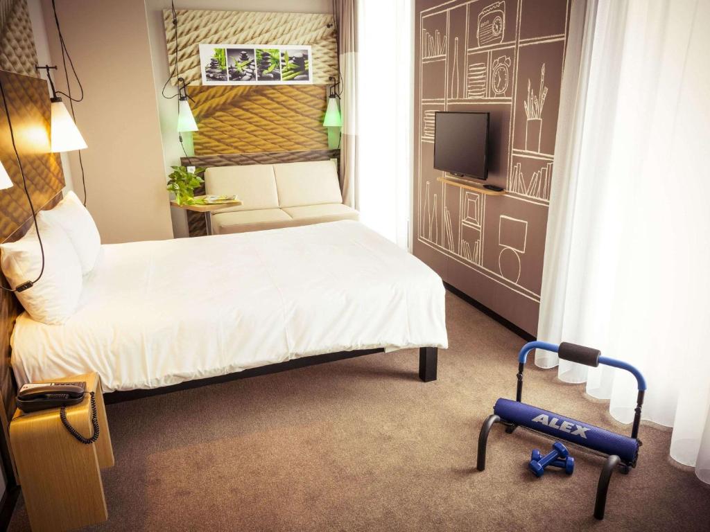 Postel nebo postele na pokoji v ubytování Ibis Berlin Hauptbahnhof